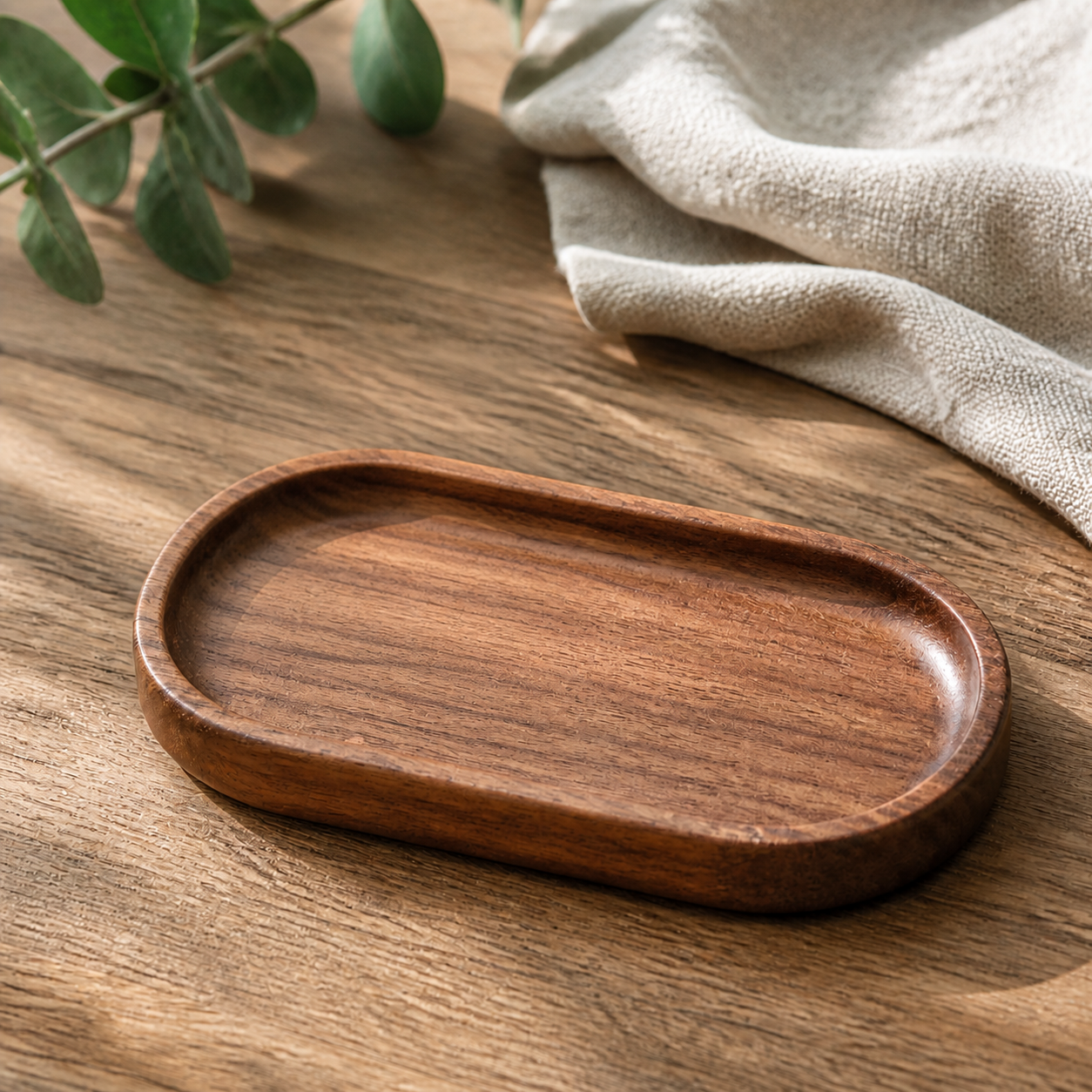Empty small 18 x 10 cm plain dark wood tray on a warm daylight tabletop
