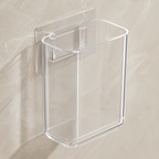 Close view of the clear open-top toothbrush cup and transparent adhesive mounting plate