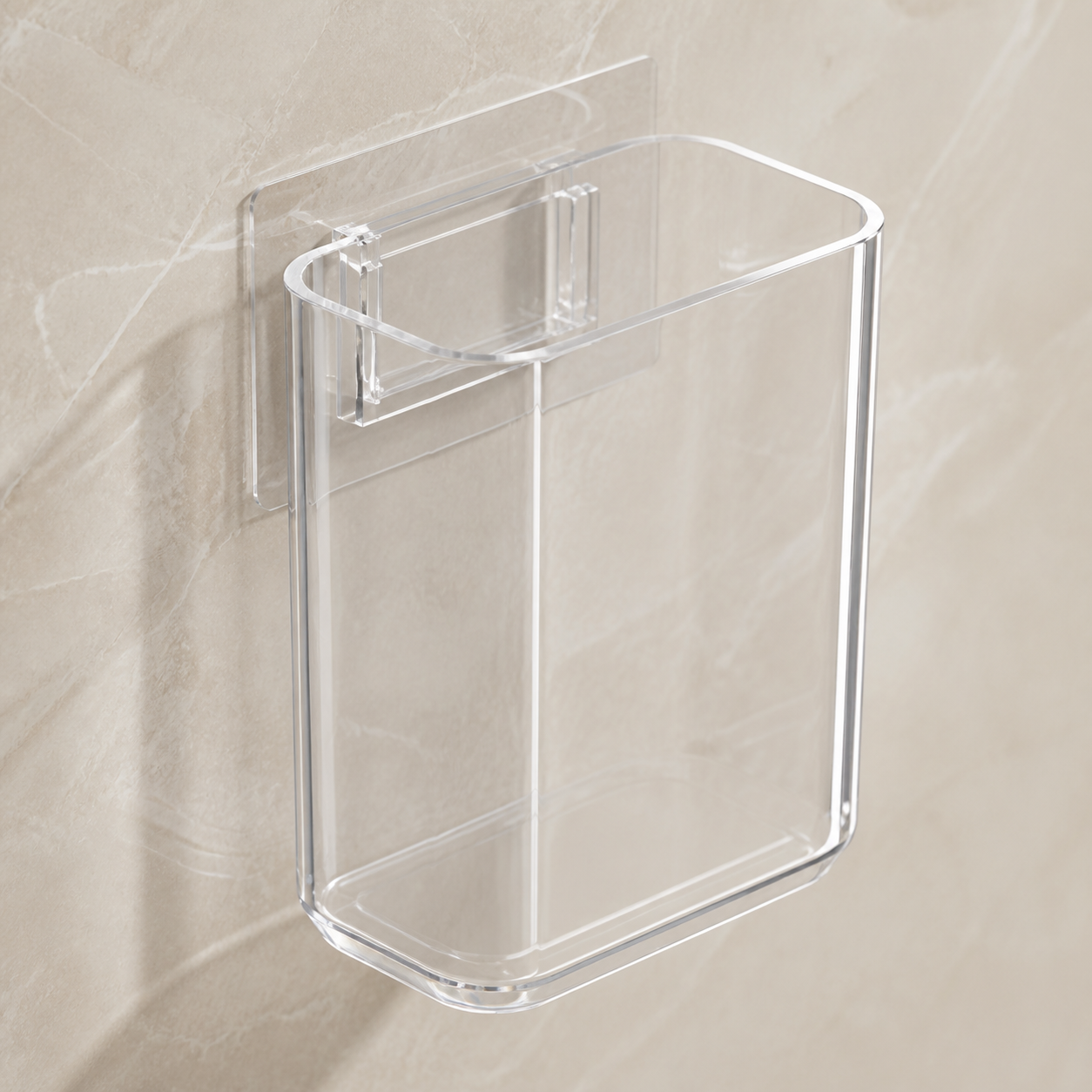 Close view of the clear open-top toothbrush cup and transparent adhesive mounting plate