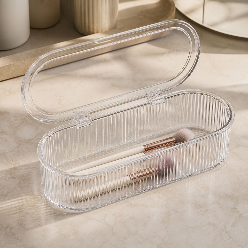 Open clear makeup brush box showing its two hinges ribbed walls and single storage cavity