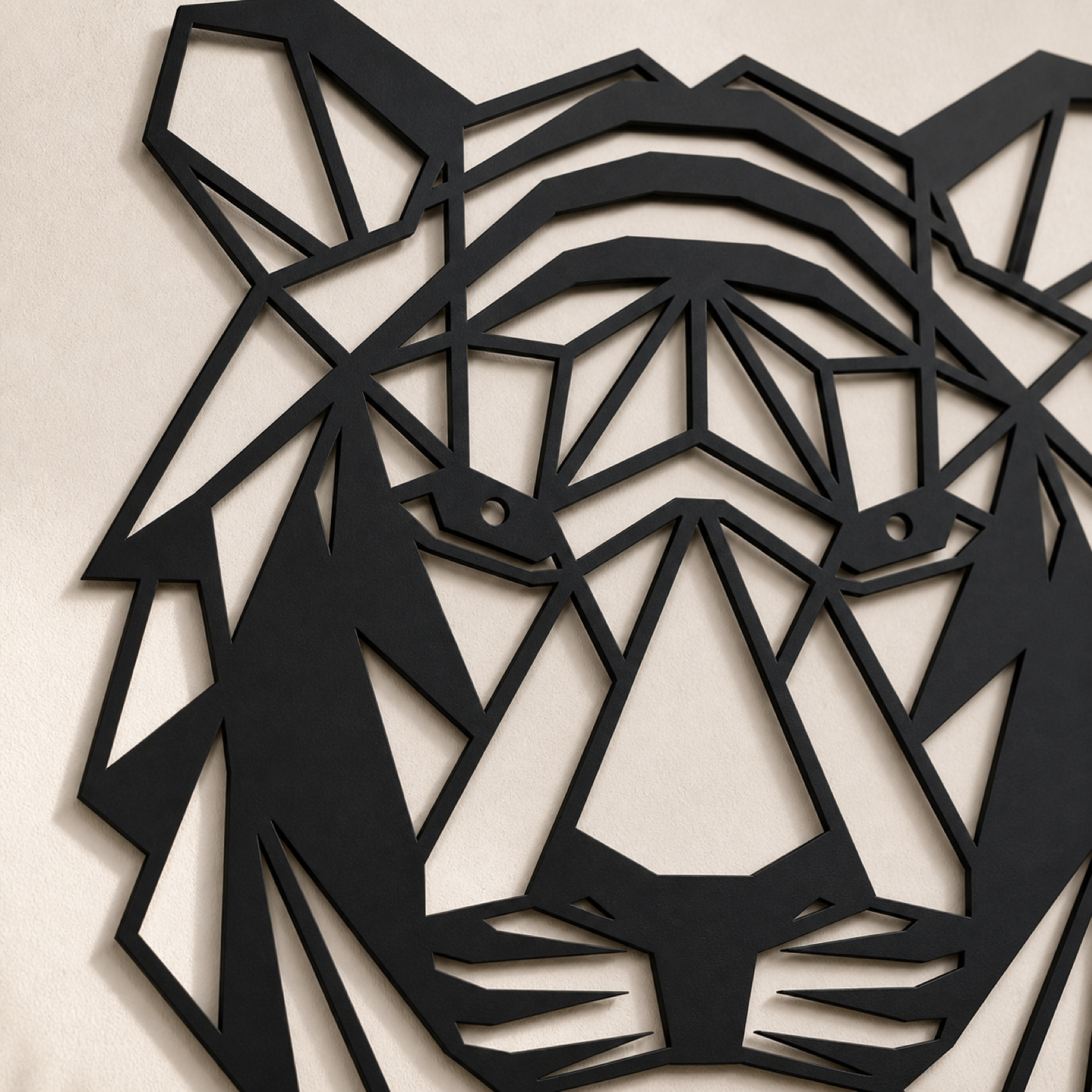Close detail of the tiger panel's cut-through geometric facets and matte black finish