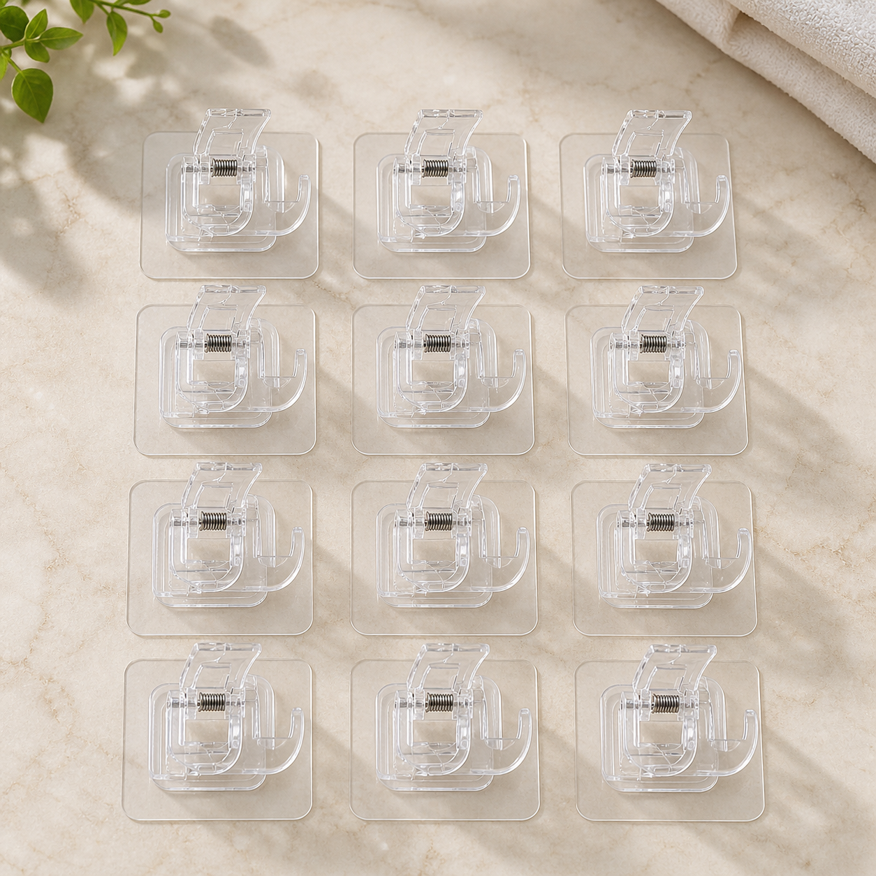 Twelve transparent self-adhesive spring curtain rod clamps arranged as the complete set