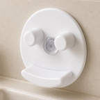 Close detail of the clear suction cup and curved ledge on the white sponge holder