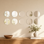 Ten identical round acrylic mirror wall stickers arranged above a console table