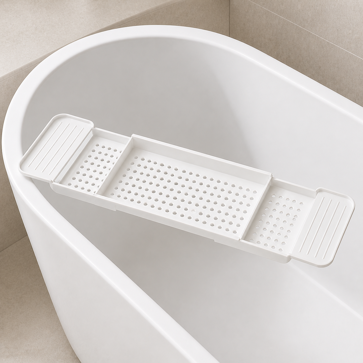 Empty matte white bathtub tray showing the continuous center basket and two sliding side extensions