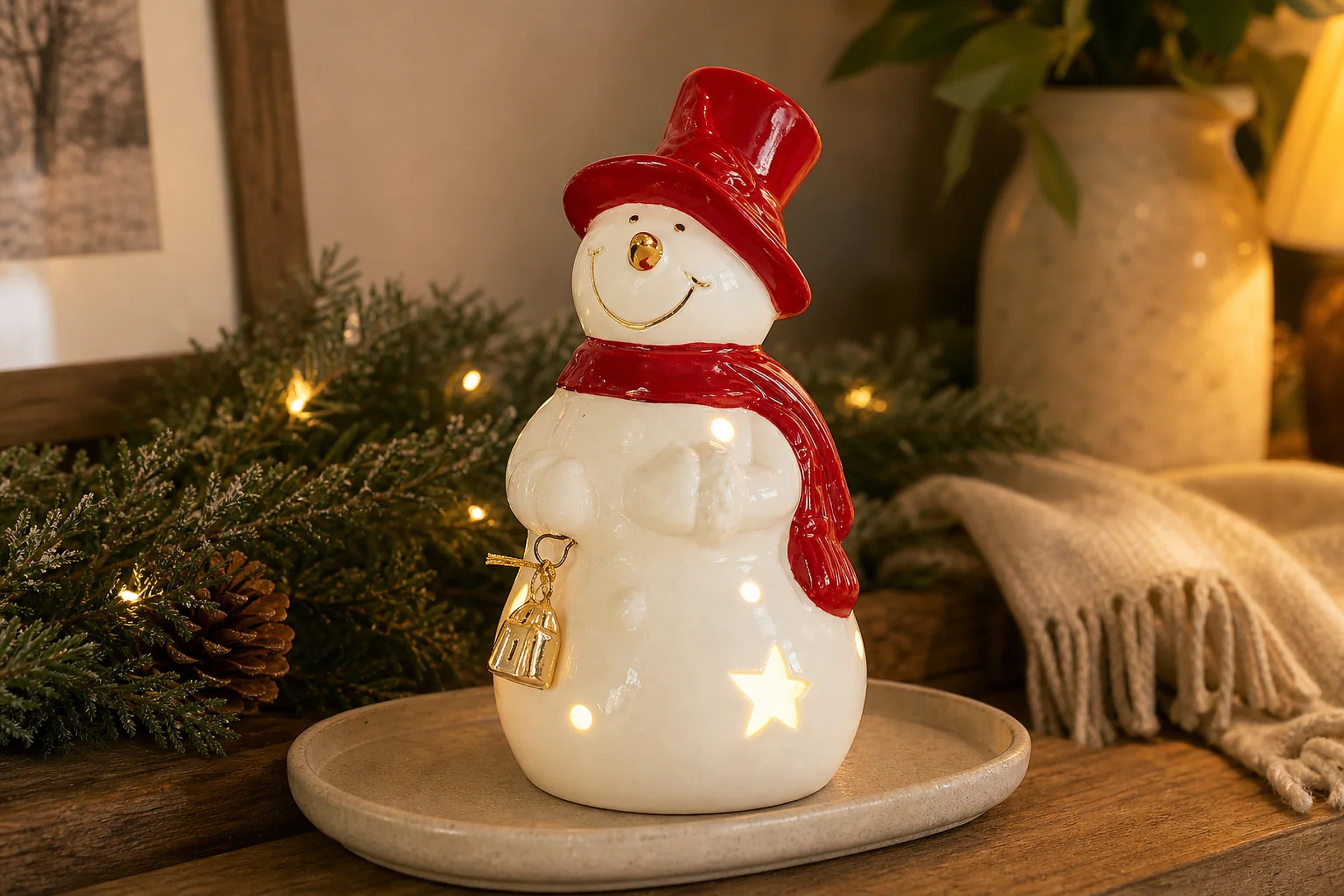 Cozy Haven LED Ceramic Holiday Village Collection lifestyle image 3 for Snowman with Star Cutout