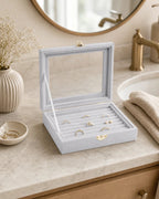 Cozy Haven gray velvet jewelry display box open beside mirror