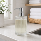 Cozy Haven clear ribbed glass soap dispenser on a laundry counter