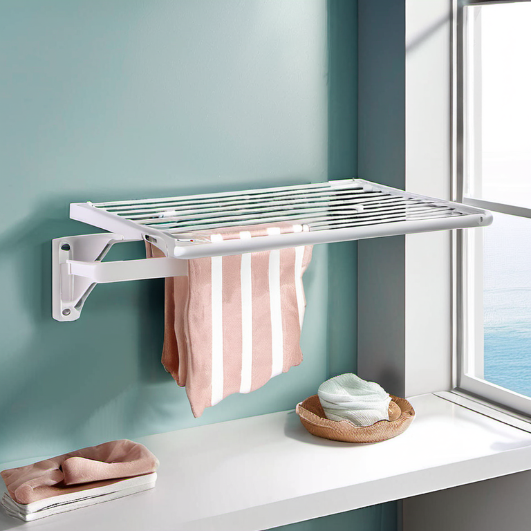 Cozy Haven desk storage lifestyle image for Cozy Haven Wall Mount Foldable Drying Rack