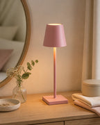 Pink LED classic table lamp on a vanity or bedside surface