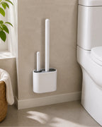 Cozy Haven white wall-hanging silicone toilet brush set mounted near a toilet