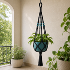 Cozy Haven Black Macrame Plant Hanger styled on covered balcony