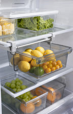 Clear refrigerator shelf drawer pulled forward with lemons