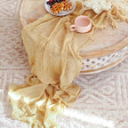 Khaki gauze table runner styled on a round dining table