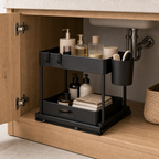 Cozy Haven Black Two-Tier Cabinet Basket Organizer in a vanity cabinet