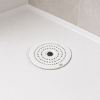 Cozy Haven Silicone Drain Hair Catcher - white silicone drain hair catcher on a bathtub drain