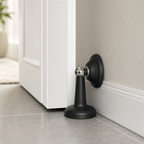 Cozy Haven Magnetic Door Stopper - black stopper installed beside an interior door