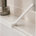 Cozy Haven White Crevice Gap Cleaning Brush cleaning a tile corner