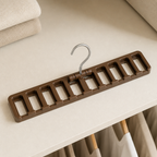 Brown molded-plastic tie organizer laid flat to show ten open slots and one chrome hook