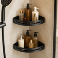 Shower caddy 2-pack in matte black — curved corner shelves mounted in a shower