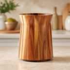 Empty rotating acacia wood utensil holder on a kitchen counter; utensils not included