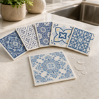 Six distinct blue retro-pattern Swedish dishcloths showing porous texture by a kitchen sink