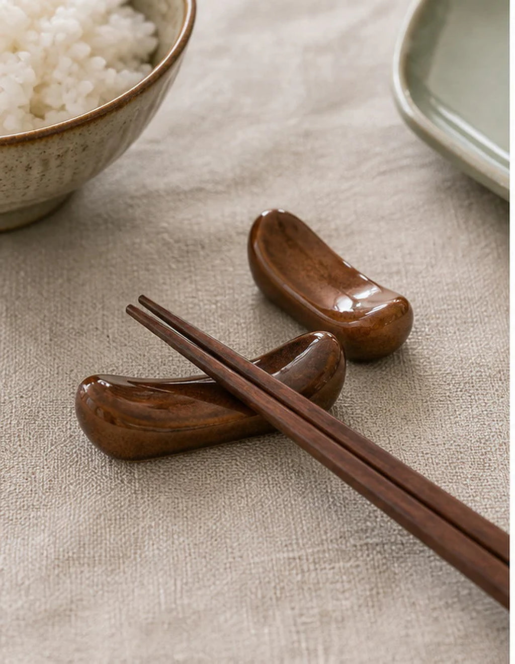 Cozy Haven Brown Ceramic Chopstick Rests - table setting detail image