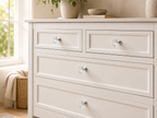 Clear diamond cabinet knobs installed on cream dresser drawers