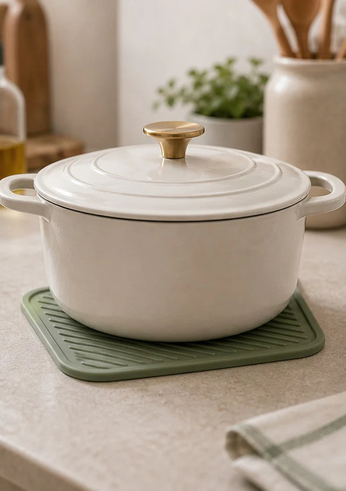 Cozy Haven Sage Silicone Trivet Mat styled in a home setting