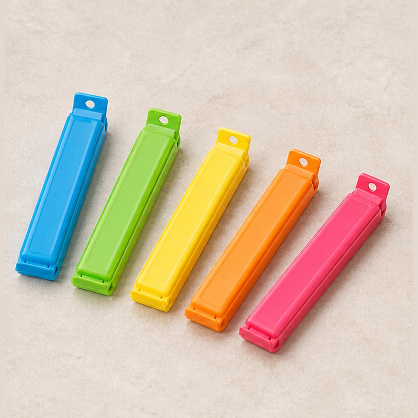 Cozy Haven Colorful Food Bag Clips - five colorful 11 cm clips angled on a neutral surface