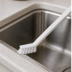 Cozy Haven White Crevice Gap Cleaning Brush scrubbing a sink edge