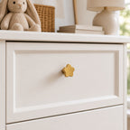 Cozy Haven Gold Flower Cabinet Knob installed on a cream drawer