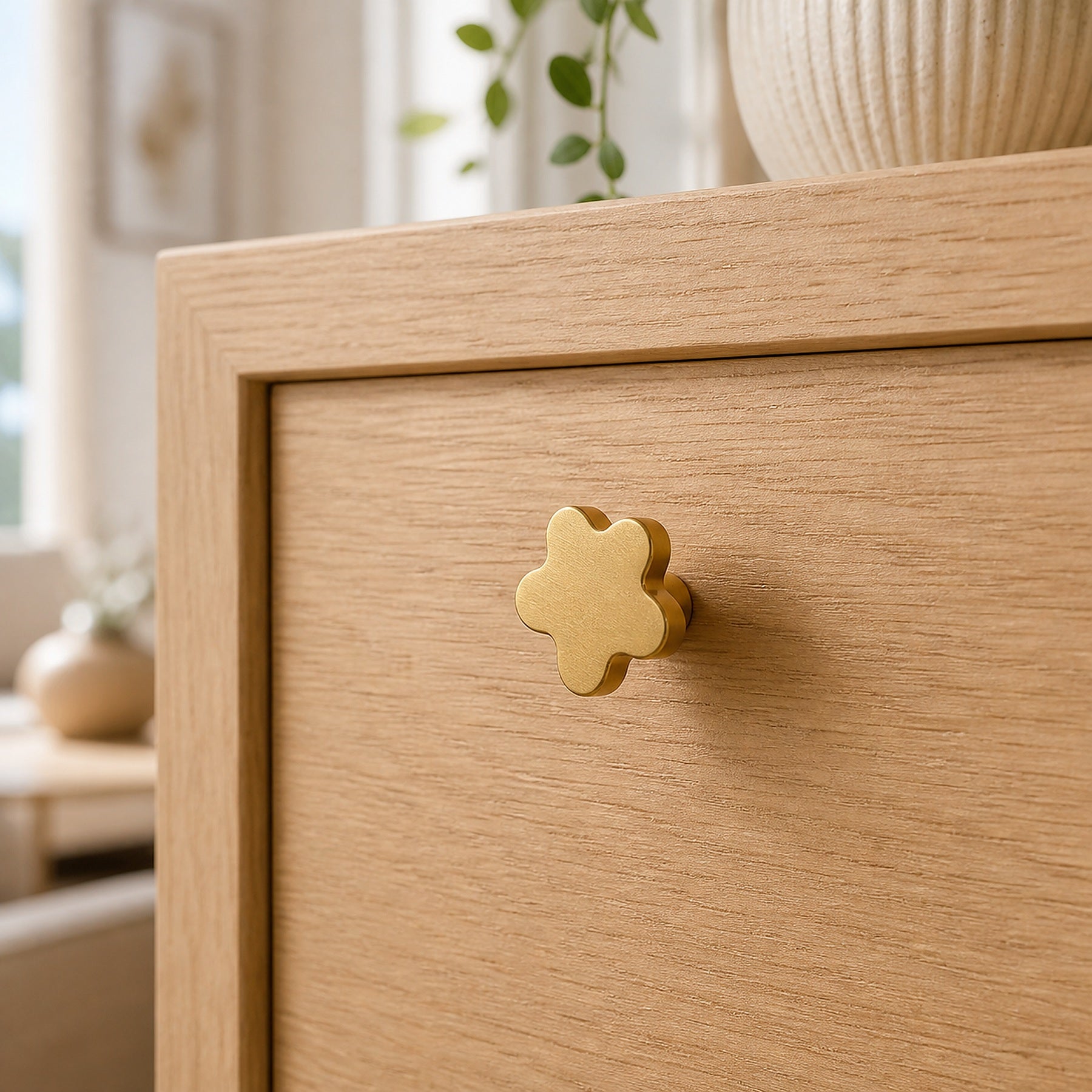 Cozy Haven Gold Flower Cabinet Knob installed on a light oak drawer