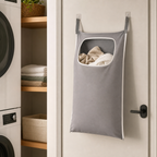 Cozy Haven gray laundry bag organizer hanging near a laundry closet