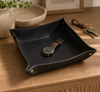Black smooth leather-look catchall tray with small daily items