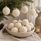 Ivory velvet flocked ball ornaments in a ceramic bowl and on an evergreen branch