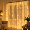 Warm white LED curtain lights behind sheer curtains in a cozy room