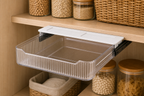 Cozy Haven Pull Out Cabinet Drawer Organizer half-extended on slide rails under a pantry shelf