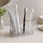Cozy Haven Stainless Toothbrush Stand with one wide and two narrow compartments on a bathroom counter