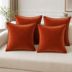 Cozy Haven velvet-feel pillow cover in Rust Red styled on sofa or bed