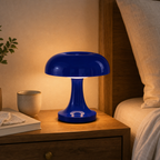 Glossy cobalt-blue LED mushroom table lamp on a warm bedside table